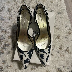 Women’s Black and Ivory high heel shoes. Size 10